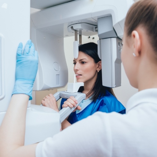 Dental patient receiving a 3 D C T cone beam x-ray scanner