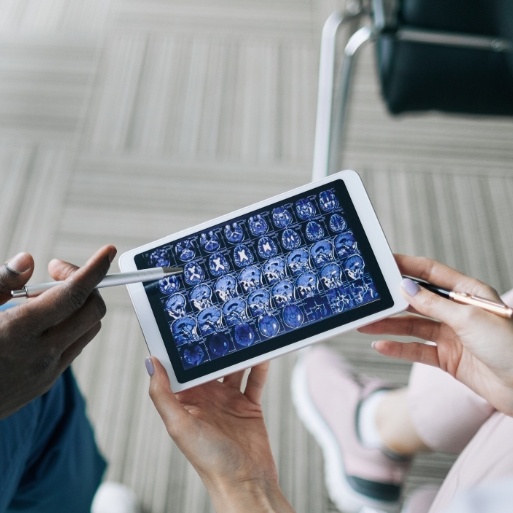 Dentist and dental team member looking at digital x-rays