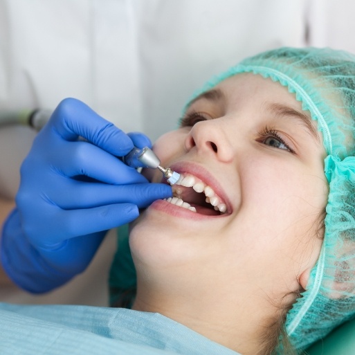 Child receiving fluoride treatment