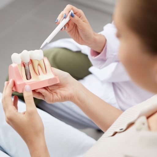 Dentist explaining dental crowns during consultation