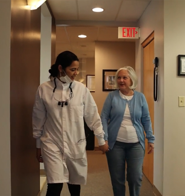 Two smiling dental patients