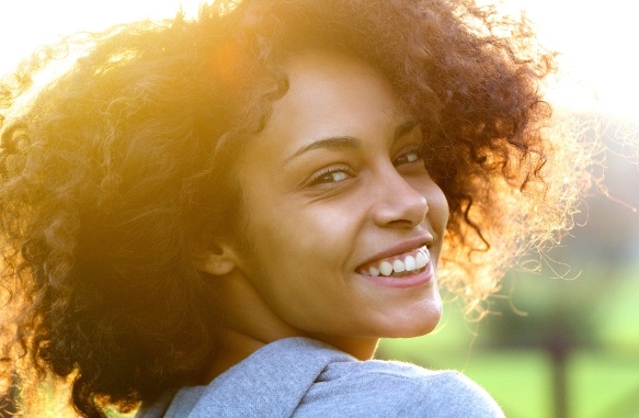 Woman with gorgeous smile after cosmetic dentistry