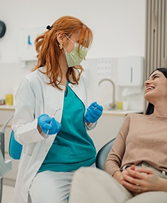Patient smiling at dentist in treatment chair