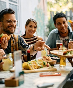 Group of friends enjoying meal outside