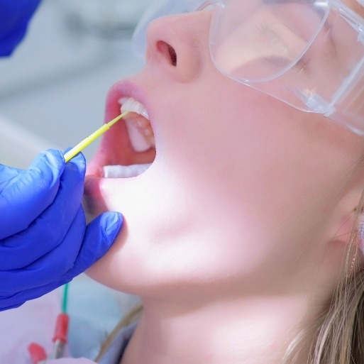 Dental patient receiving fluoride treatment