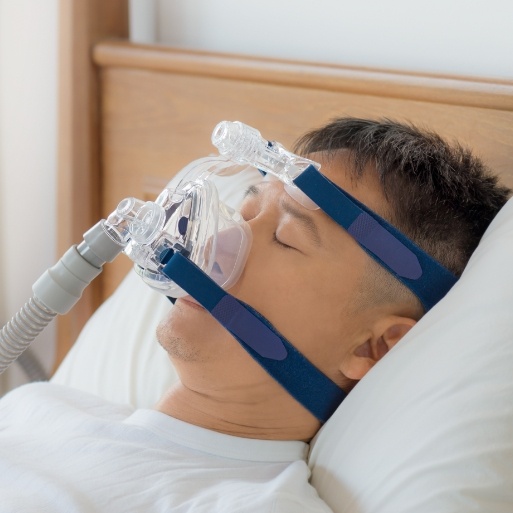 Patient wearing CPAP mask for sleep apnea therapy
