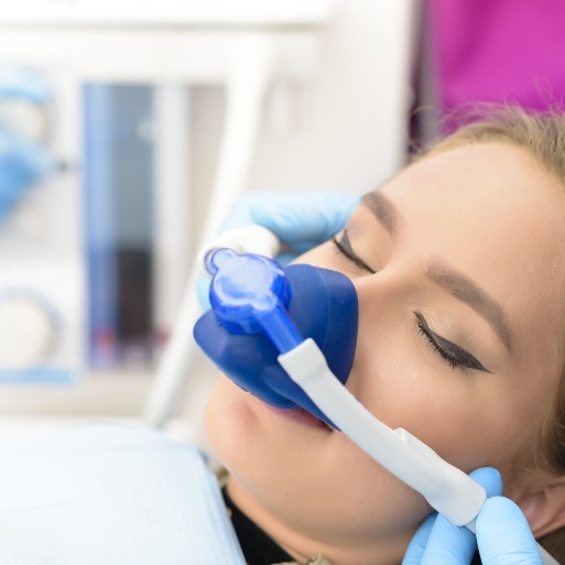 Patient receiving dentistry services under nitrous oxide dental sedation