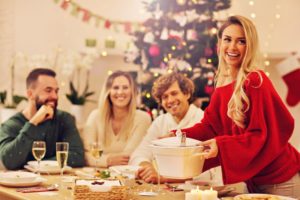 woman red sweater blonde hair smiling