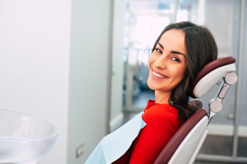 Smiling woman in dentist's chair