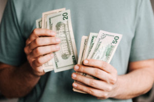 Man’s hands counting cash